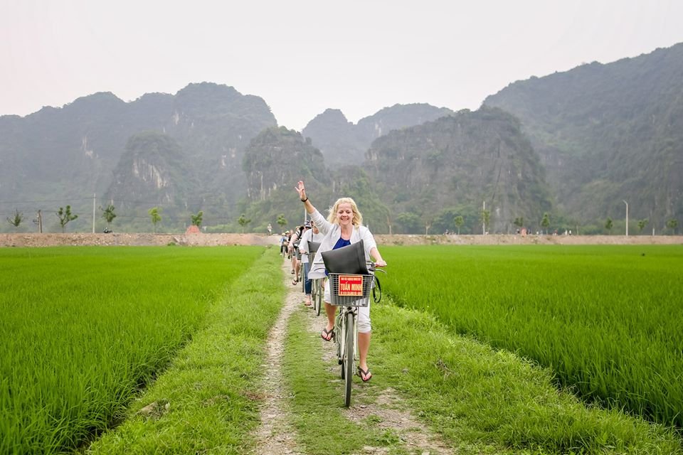 1764477803_riding-bike-on-countryside-road-with-tam-coc-boat-tour-ha-noi-explore-travel.jpg